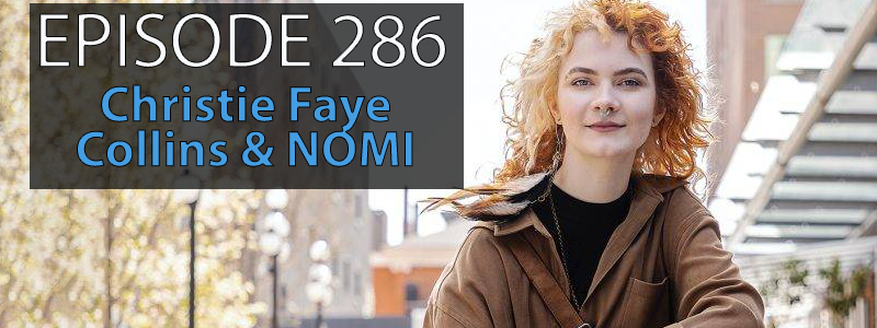 Christie Faye Collins, a young woman with curly shoulder length hair, sits on a series of concrete steps with Downtown Victoria in the background. The words Episode 286 Christie Faye Collins & NOMI sits in the upper right hand corner of the image.