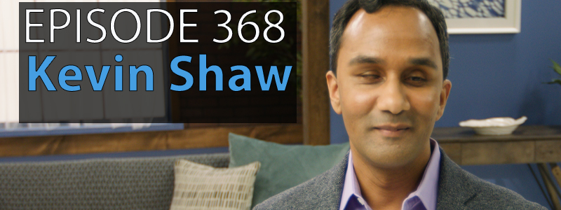 Text reads Episode 368 - Kevin Shaw. A picture of Kevin beside it, Kevin has short black hair and wears a grey sports jacket over a light purple dress shirt.